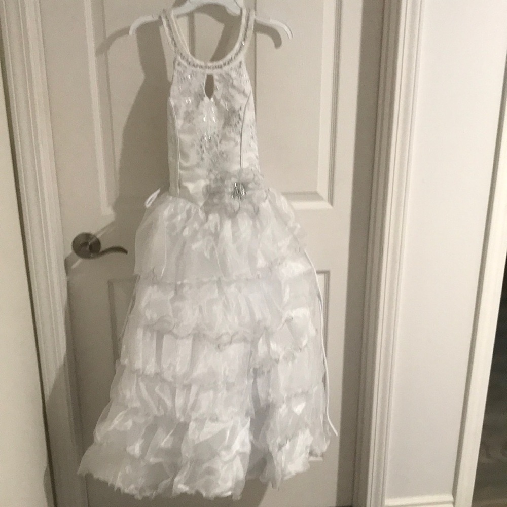 White gown with bodice embellishments.  Straps changeable to crisscross back